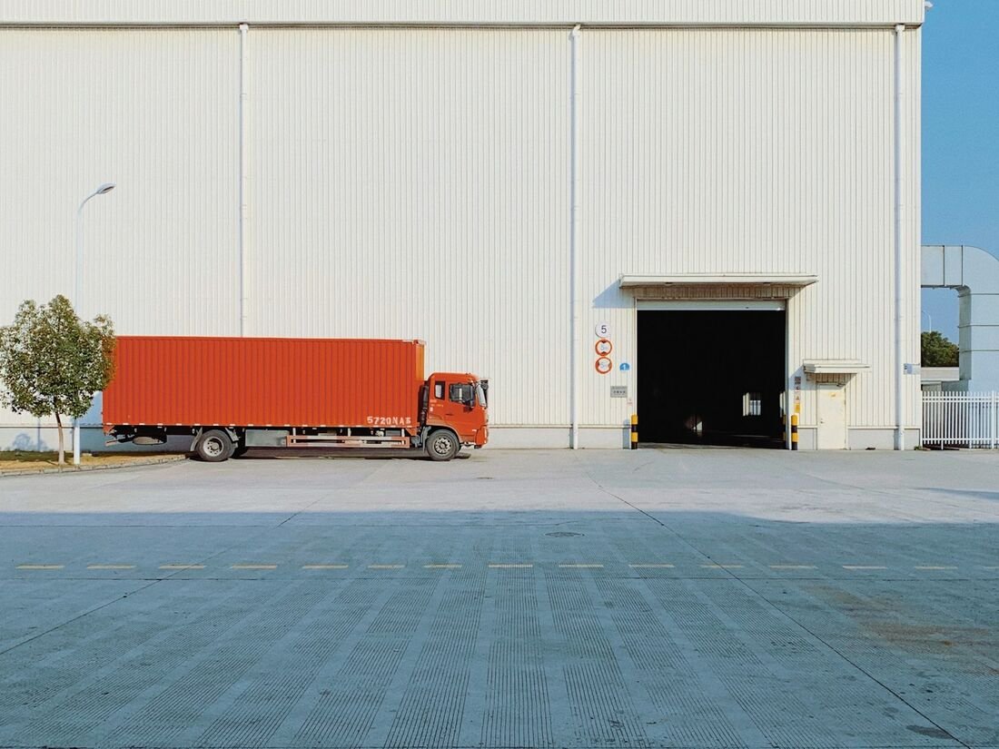 Freight truck loaded at a distribution building